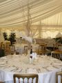 Table set up for dining in marquee in Berkshire